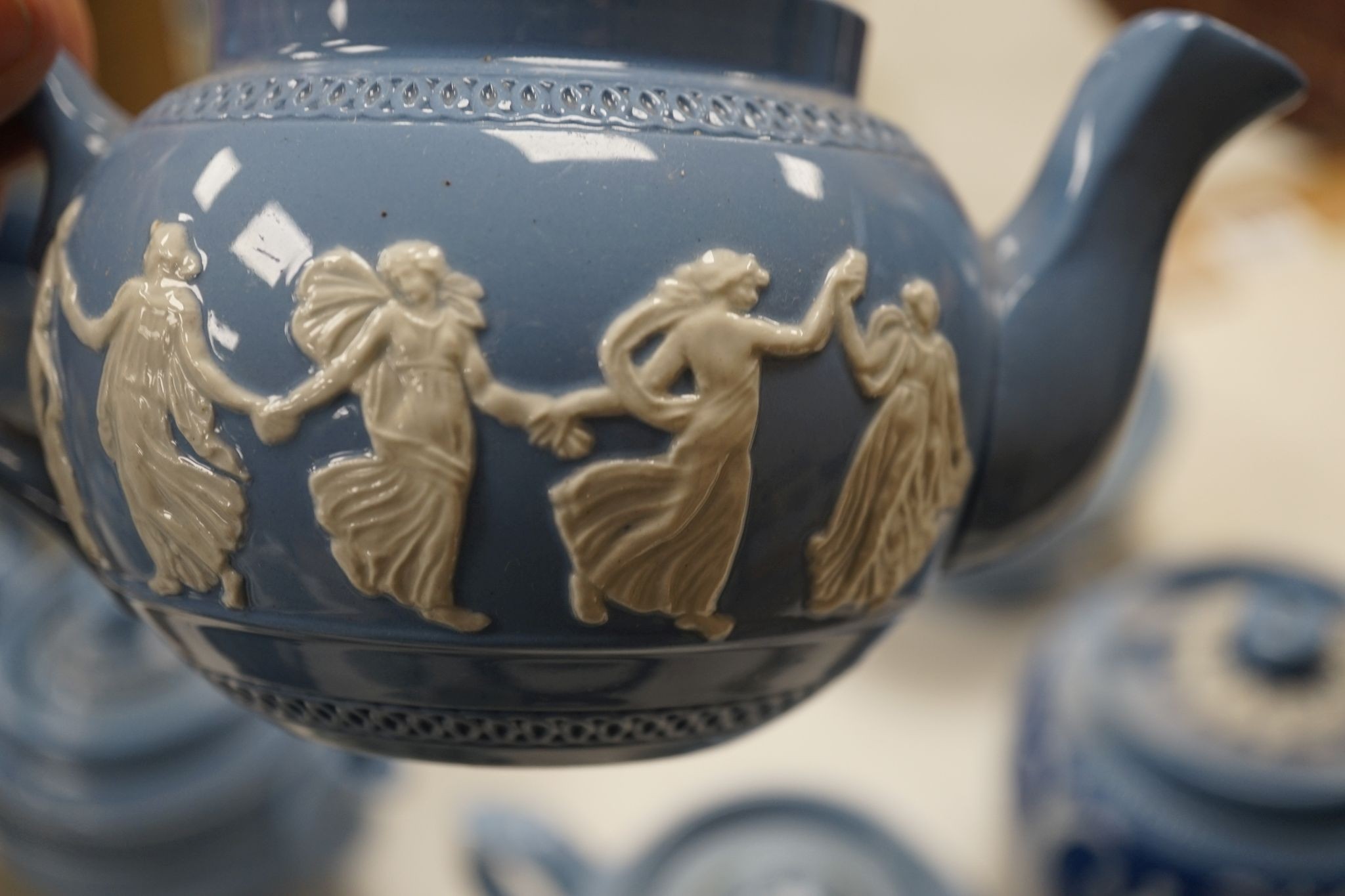 A collection of Dudson stoneware, including jugs, teapots, cream jugs etc, many decorated in low relief
